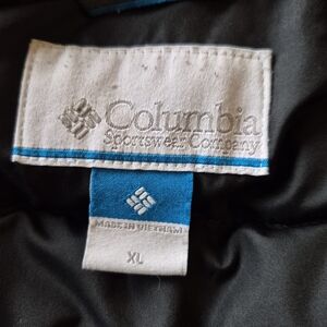 Columbia 100% Polyester Jacket.  With a 2 X 3 Inch Hole On Sleeve.